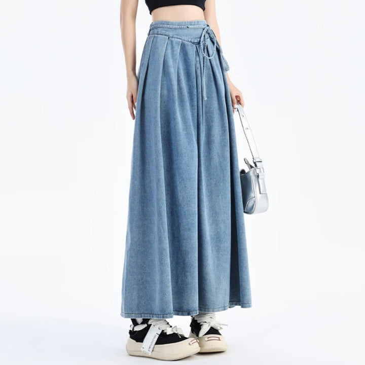 Stylish women's casual blue denim midi skirt, versatile for summer fashion and everyday comfort.