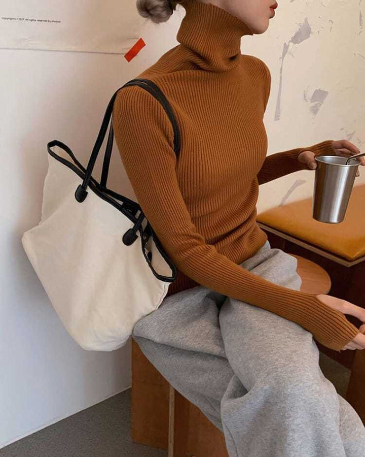 Stylish women's pullover, a chic long sleeve turtleneck sweater for cozy winter fashion.