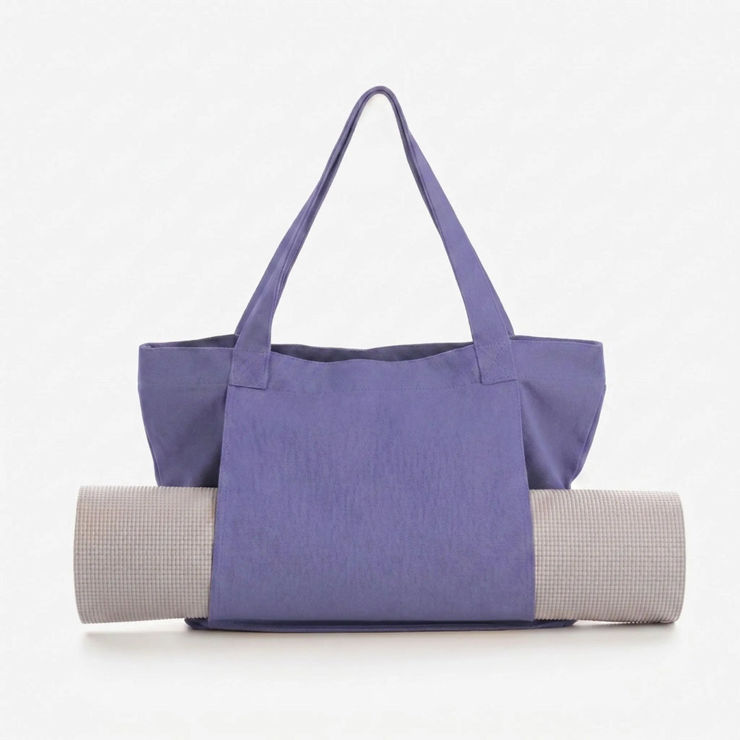 Stylish women's canvas yoga mat tote bag. Perfect for fitness, gym, and daily essentials. Versatile shoulder carry.