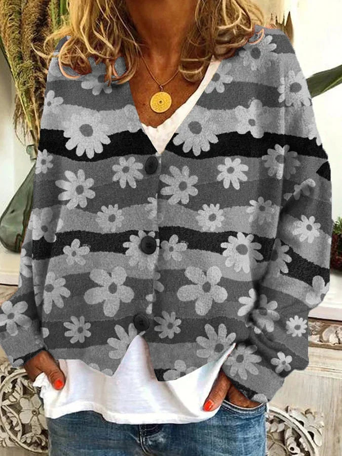 Effortless women's button-up cardigan: a vibrant floral & stripe pattern on a comfortable relaxed fit.