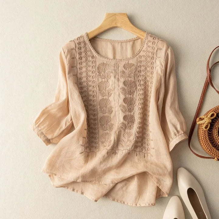 Women's vintage embroidered blouse with elegant puff sleeves, round neck, ideal for spring & summer fashion.