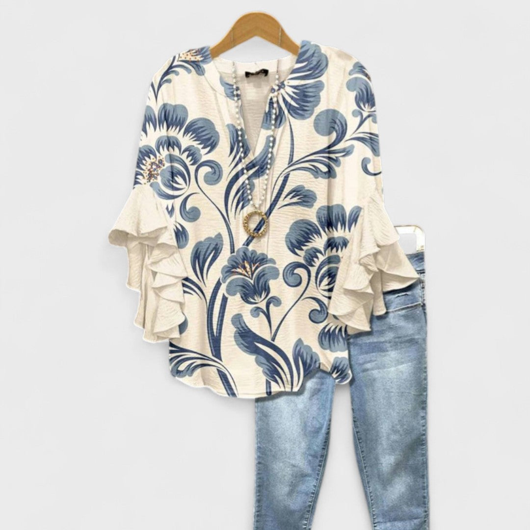 Women's vintage floral V-neck blouse with ruffle sleeves, elegant design.