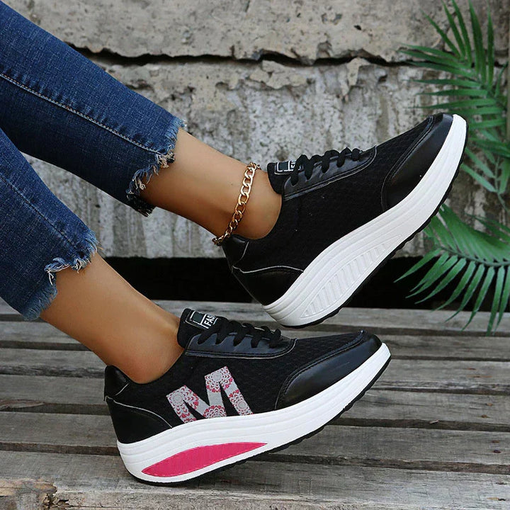 Women's comfortable walking sneakers, featuring breathable fabric and supportive design for all-day wear and activity.