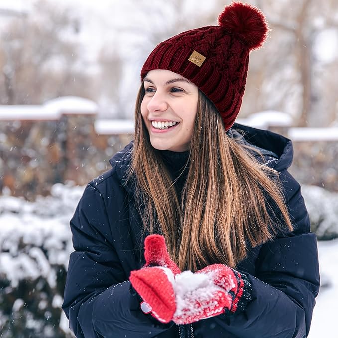 Women's accessories: warm winter cable knit pom beanie with soft fleece interior.