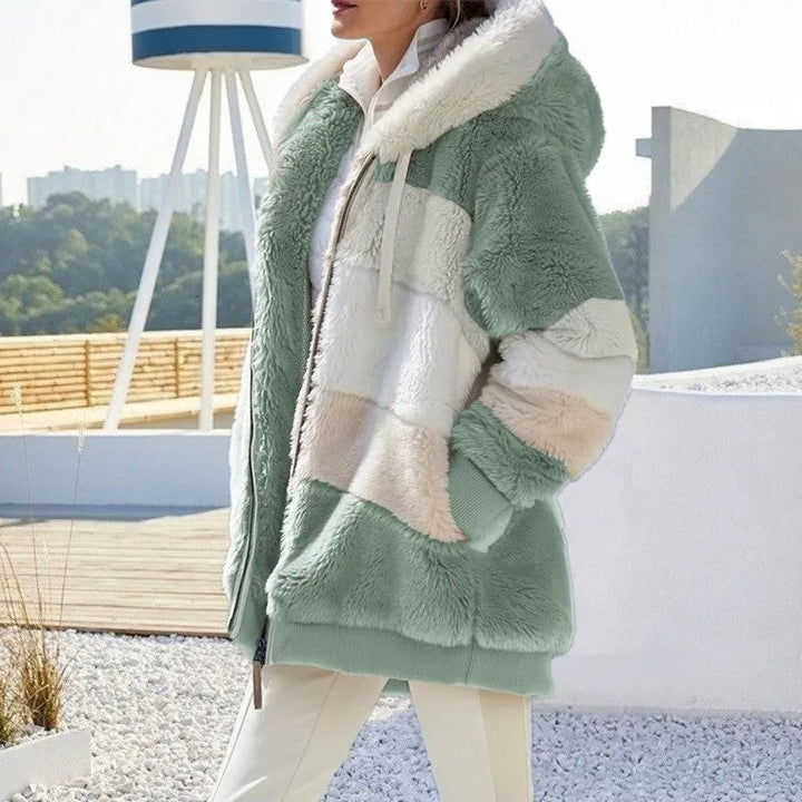 Versatile women's hooded winter coat, combining warmth, style, and everyday functionality.