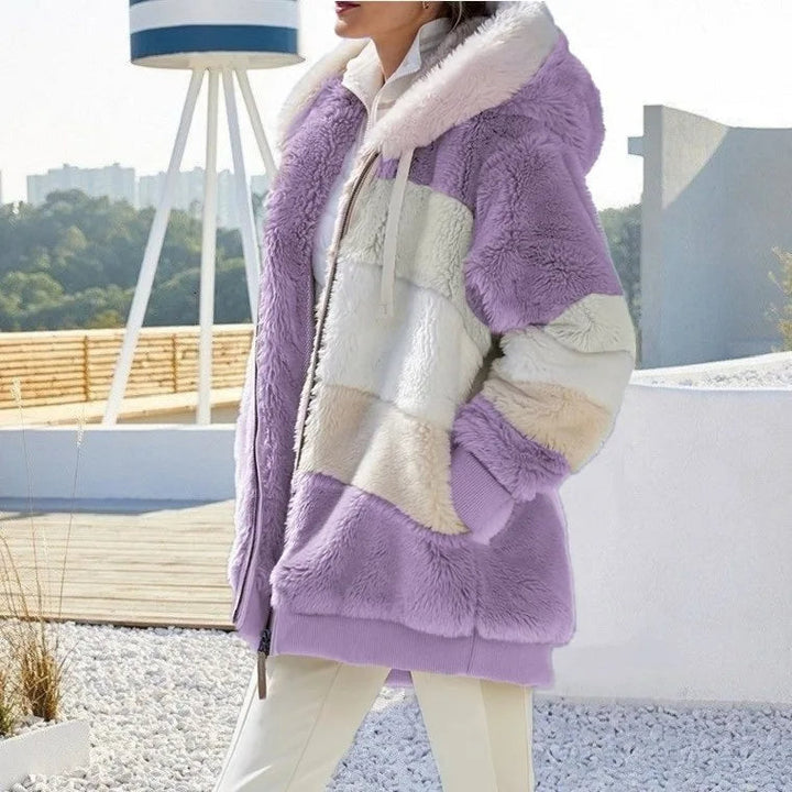 Plush women's hooded winter coat, designed for maximum warmth and everyday comfort.
