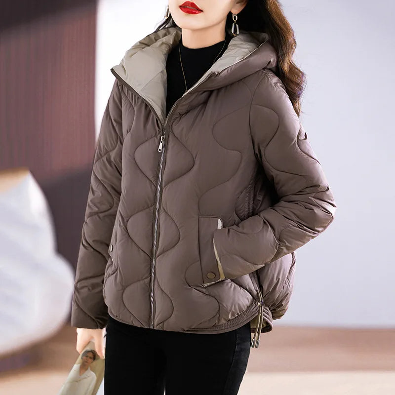 Fashionable & warm women's quilted puffer jacket. Insulated winter outerwear for chic everyday wear.