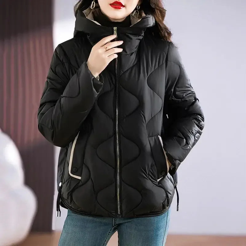 Everyday women's insulated puffer jacket. Combines warmth, style, and casual comfort for winter.