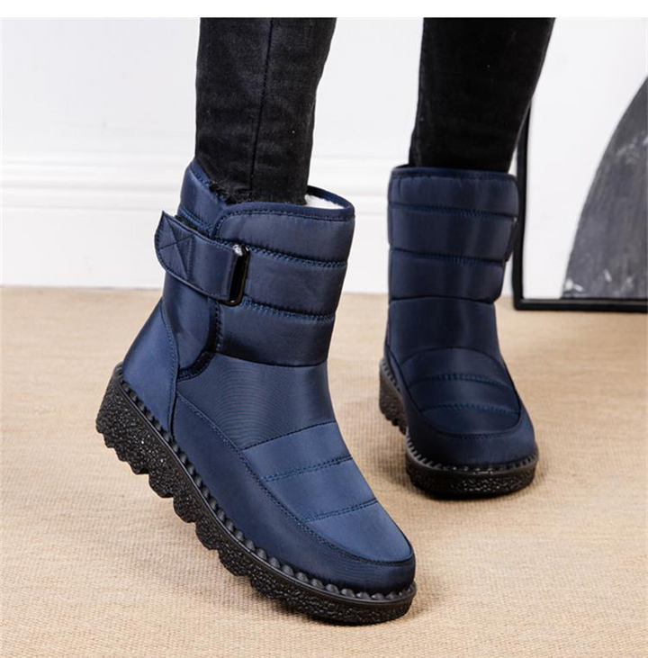 High-performance women's winter boots, waterproof, padded, and anti-slip for extreme cold.