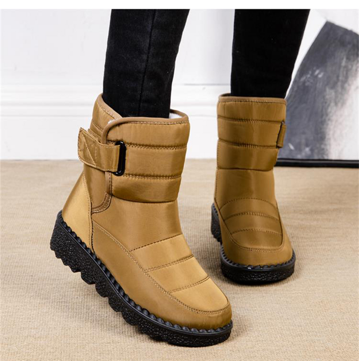 Plush padded women's waterproof boots with warm lining for ultimate winter protection.