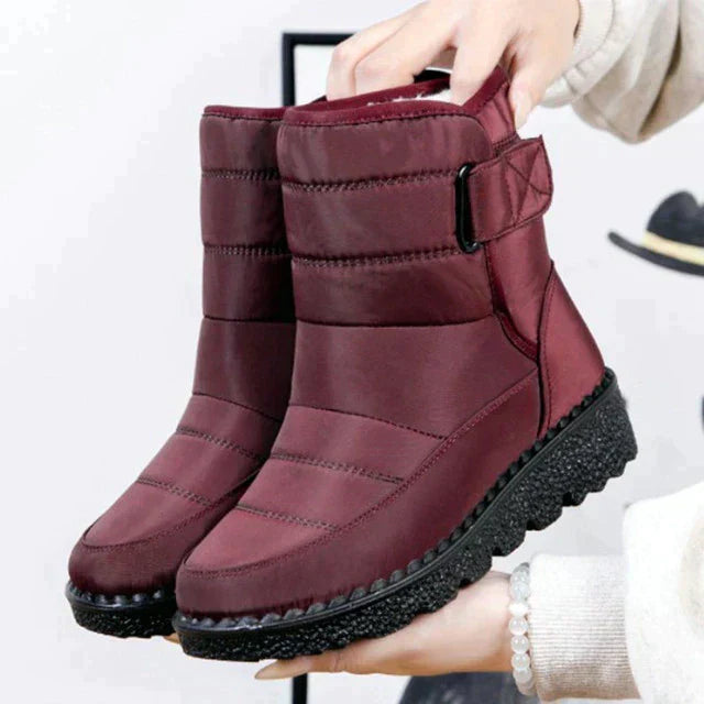 Stylish women's fashion winter boots, warm, padded, and waterproof for snowy outdoor adventures.