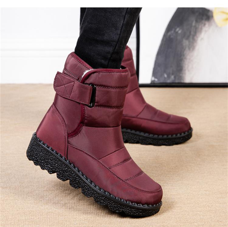 Modern women's waterproof winter boots, padded and warm, perfect for snowy fashion.