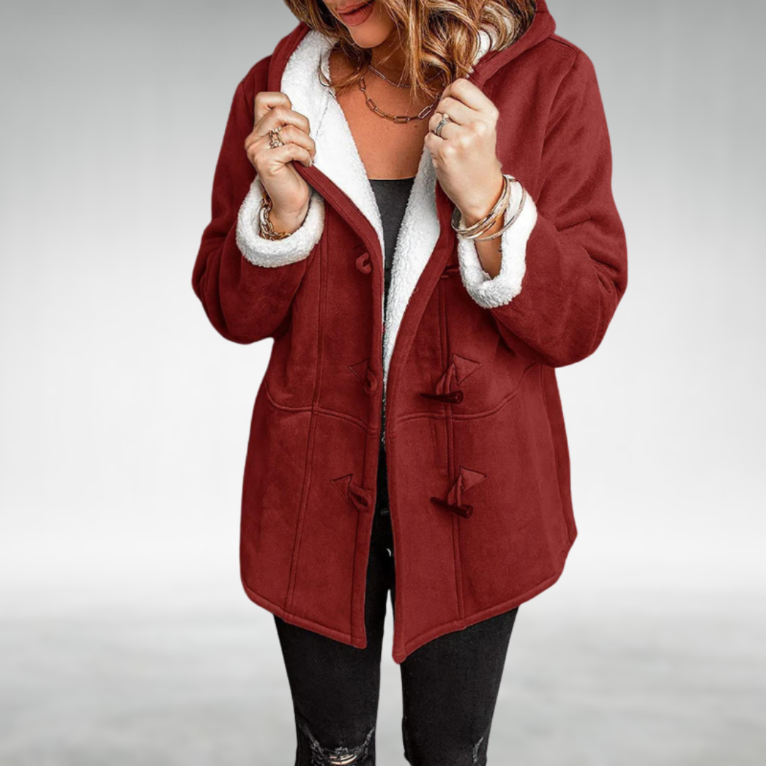 Elegant hooded women's winter coat featuring warm plush lining & toggle closure, ideal for seasonal cold weather.