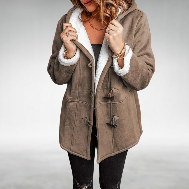 Warm women's winter coat with soft plush lining, a hooded design for comfort in cold weather outerwear.