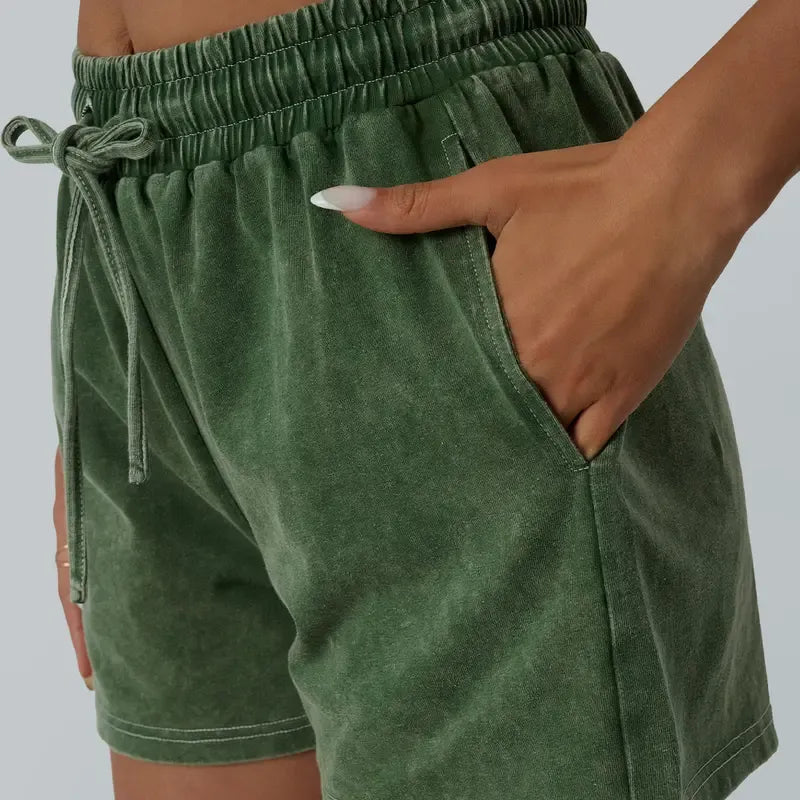 Comfortable women's washed cotton lounge set, two-piece relaxed fit with adjustable shorts for casual style.
