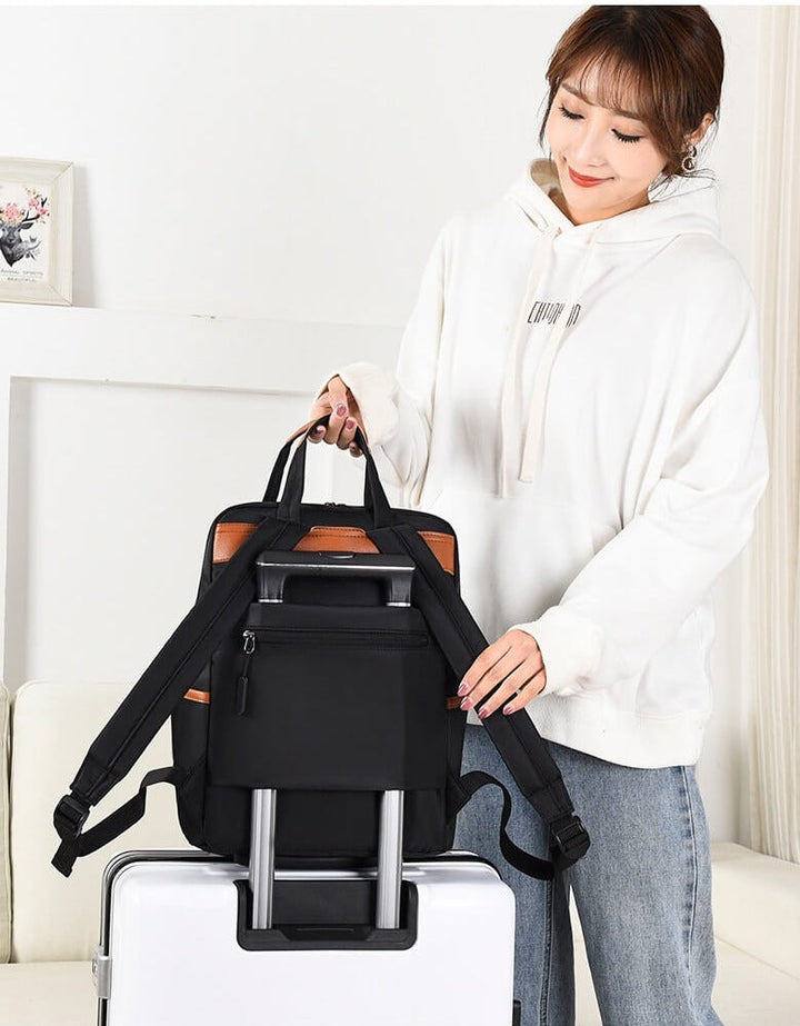 Front view of a women's water-resistant anti-theft travel backpack in sleek Oxford design.