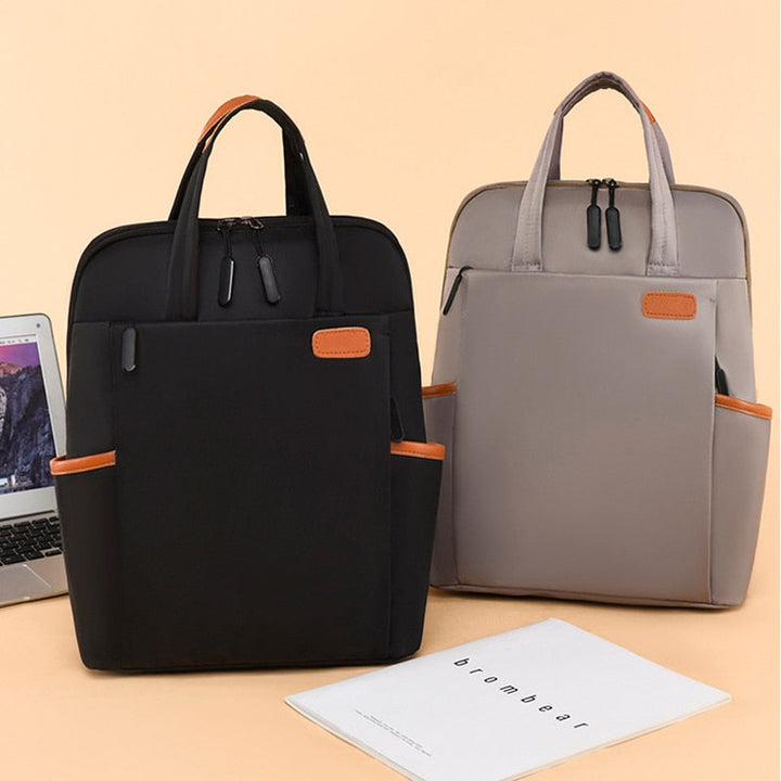 Spacious women's water-resistant anti-theft travel backpack, organized compartments, secure.
