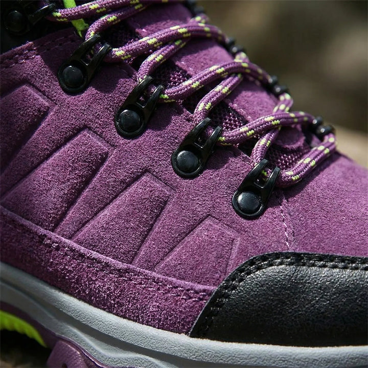 Durable women's water-resistant outdoor shoes, ideal for hiking & trekking in varied terrains.