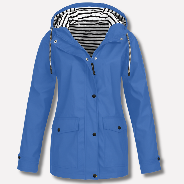 Lightweight women's travel raincoat, a waterproof hooded jacket for reliable all-weather protection.