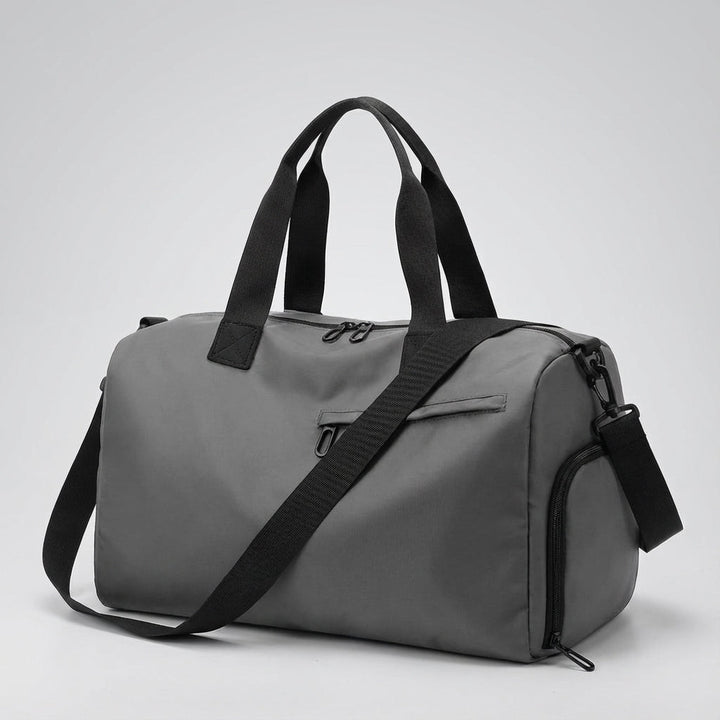 Modern women's duffel bag featuring a shoe compartment. Made of waterproof nylon, ideal for gym & travel.