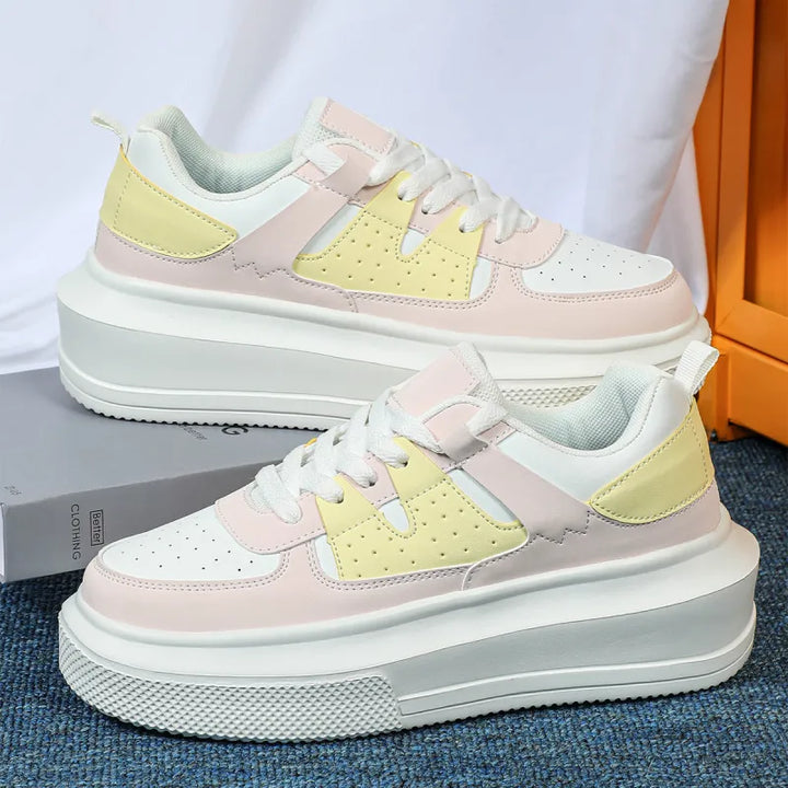 Trendy women's lace-up platform sneakers featuring stylish perforations for a comfortable fashion look.