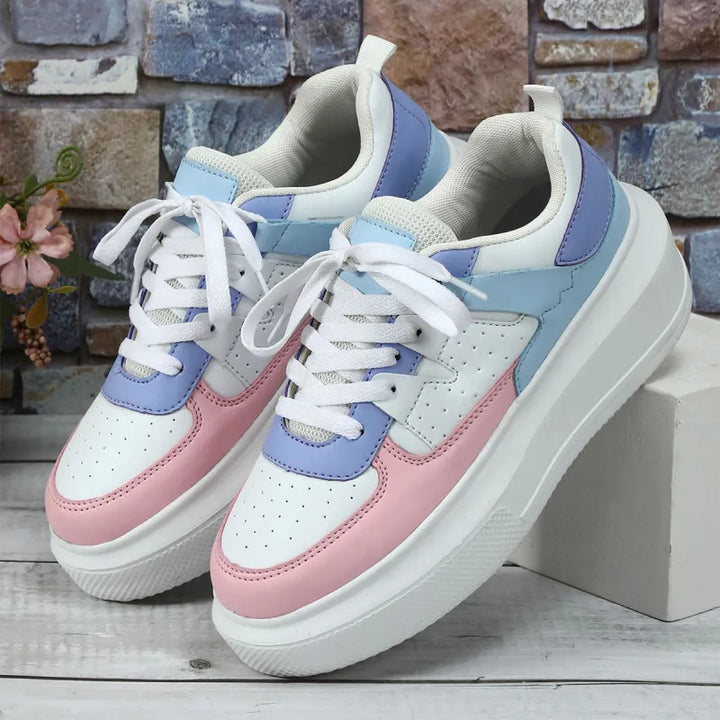 Everyday women's athletic platform sneakers, perforated for breathability and secured with laces.