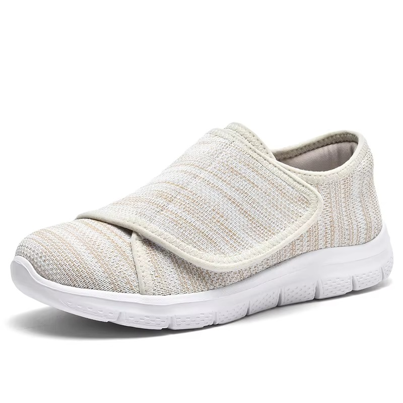 Orthopedic women's wide fit sneakers, offering adjustable comfort & lightweight support for extended walks.