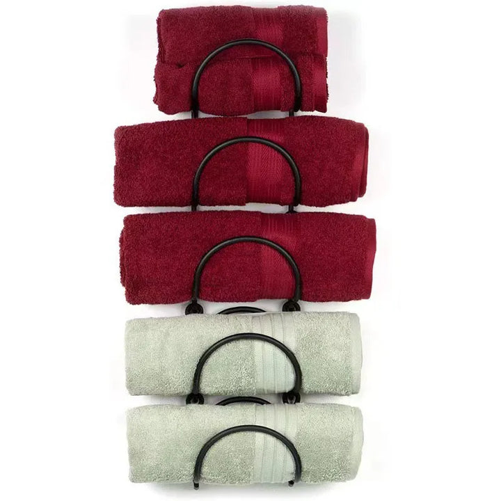 Durable wrought iron multi-layer towel rack, a chic wall-mounted solution for bathroom organization and decor.
