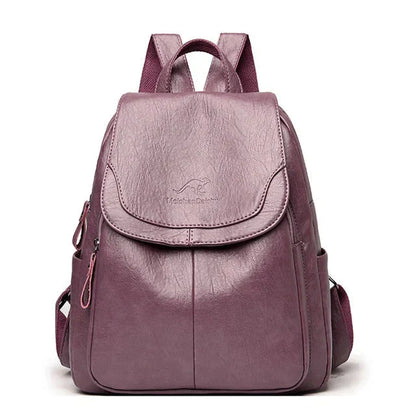 "Zaino in pelle marrone elegante e spazioso con chiusura a cerniera, ideale per donna moderna e multifunzionale."