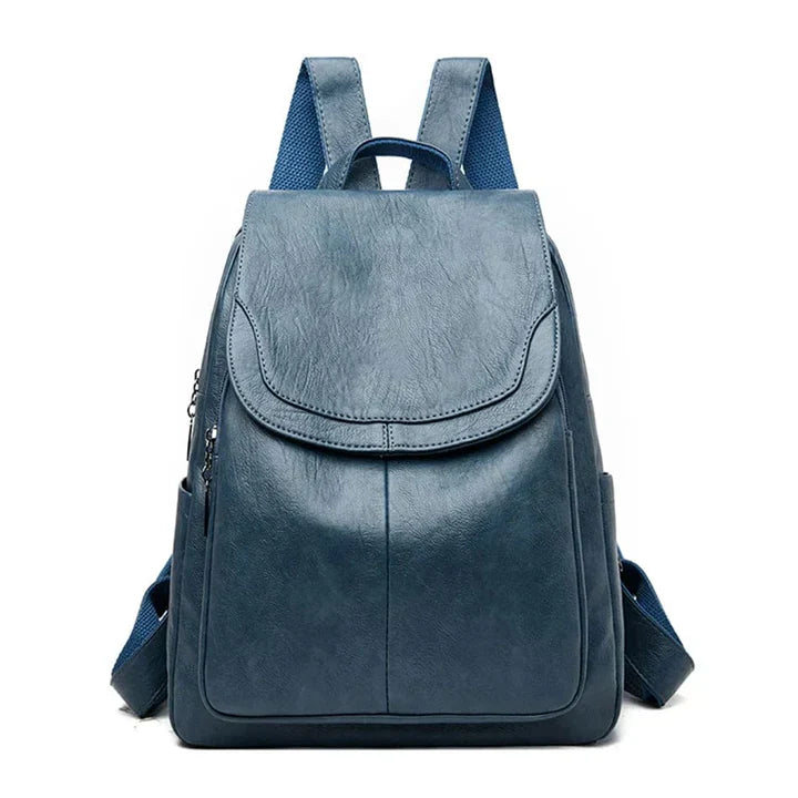 "Zaino in pelle marrone elegante e spazioso con chiusura a cerniera, ideale per donna moderna e multifunzionale."