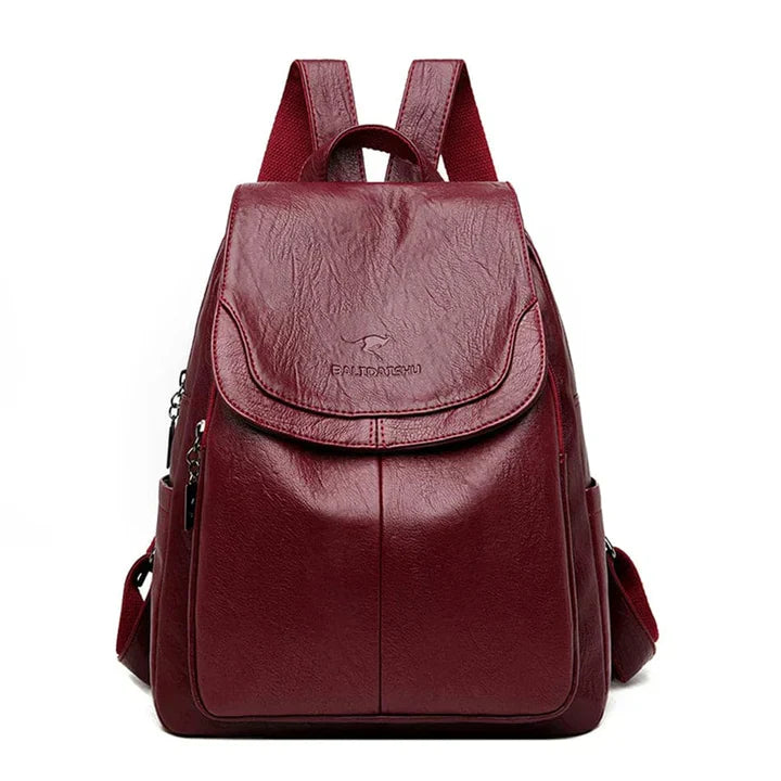 "Zaino in pelle marrone elegante e spazioso con chiusura a cerniera, ideale per donna moderna e multifunzionale."
